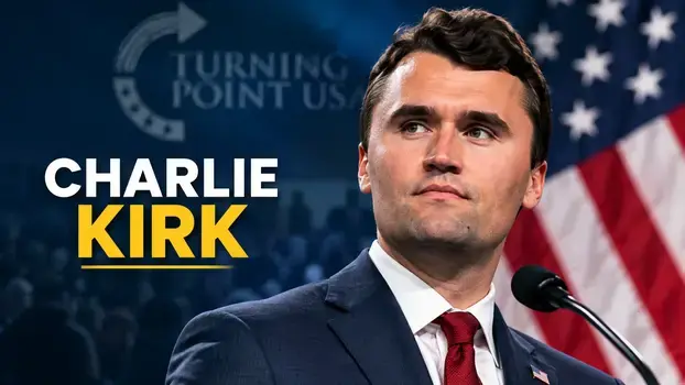 Charlie Kirk speaking at a political event with American flag background